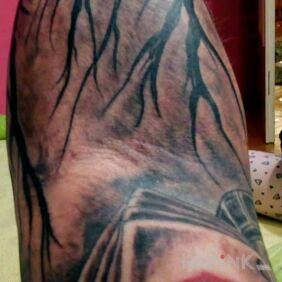 Tattoo Dark forest on the forearm motif: black and gray style: graphic / illustrative