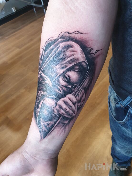 Tattoo Archer in characters motif and realistic style on the forearm