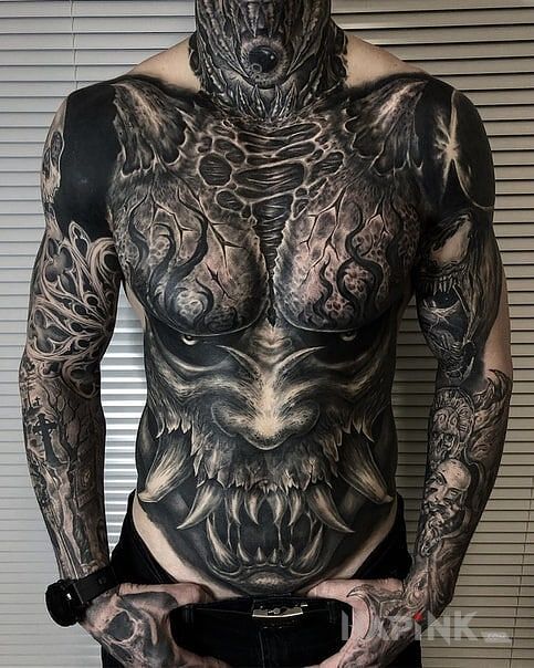 Tattoo Zebaty demon in colorful motif and realistic style on the upper arm