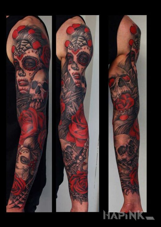 Tattoo Santa Muerte czerwone in flowers motif and realistic style on the forearm