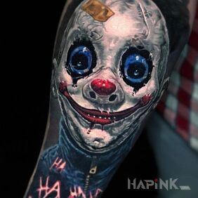 Tattoo You clown on the forearm motif: dark style: realistic