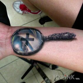 Tattoo Magnifier on the forearm motif: 3D style: realistic