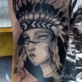 Tattoo Indian woman on the upper arm motif: faces style: graphic / illustrative