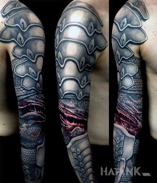 Tattoo Ręka w zbroi in black and gray motif and realistic style on the upper arm