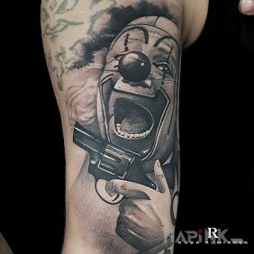 Tattoo Clown2 on the forearm motif: faces style: realistic