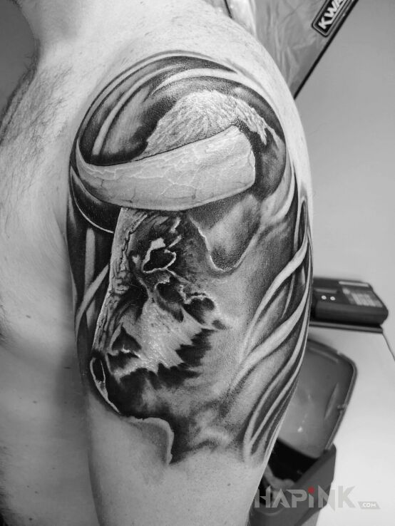 Tattoo Pierwszy i nie ostatni in zodiac signs motif and graphic / illustrative style on the upper arm