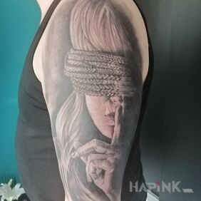 Tattoo New acquisition:) on the upper arm motif: black and gray style: realistic