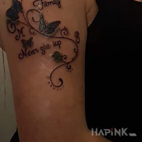 Tattoo My first family ? on the upper arm motif: butterflies style: graphic / illustrative