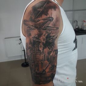 Tattoo Without on the upper arm motif: war style: realistic