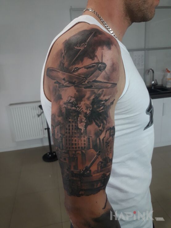 Tattoo Bez in black and gray motif and realistic style on the upper arm