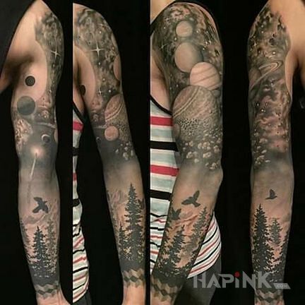 Tattoo Ziemia i kosmos in black and gray motif and realistic style on the upper arm