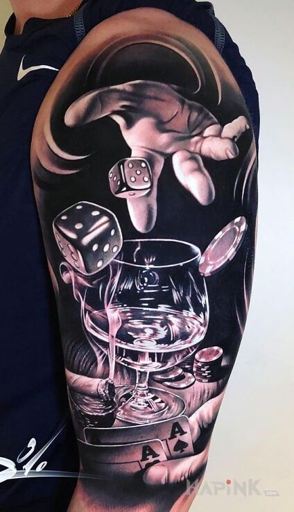 Tattoo Kasyno in black and gray motif and realistic style on the upper arm