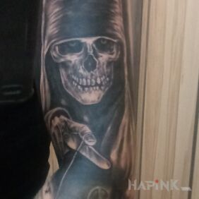 Tattoo Chekhov on the upper arm motif: black and gray style: realistic