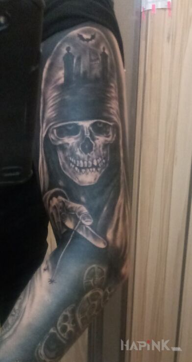 Tattoo Czecha in black and gray motif and realistic style on the upper arm