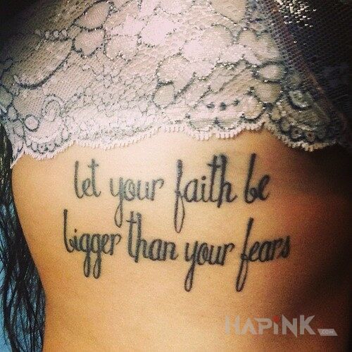 Tattoo Dewiza in lettering motif on the ribs
