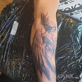 Tattoo Angel on the forearm motif: black and gray style: realistic