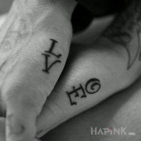 Tattoo LOVE on the hand motif: Love