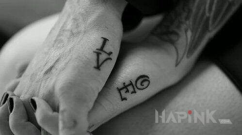 Tattoo LOVE in Love motif on the hand
