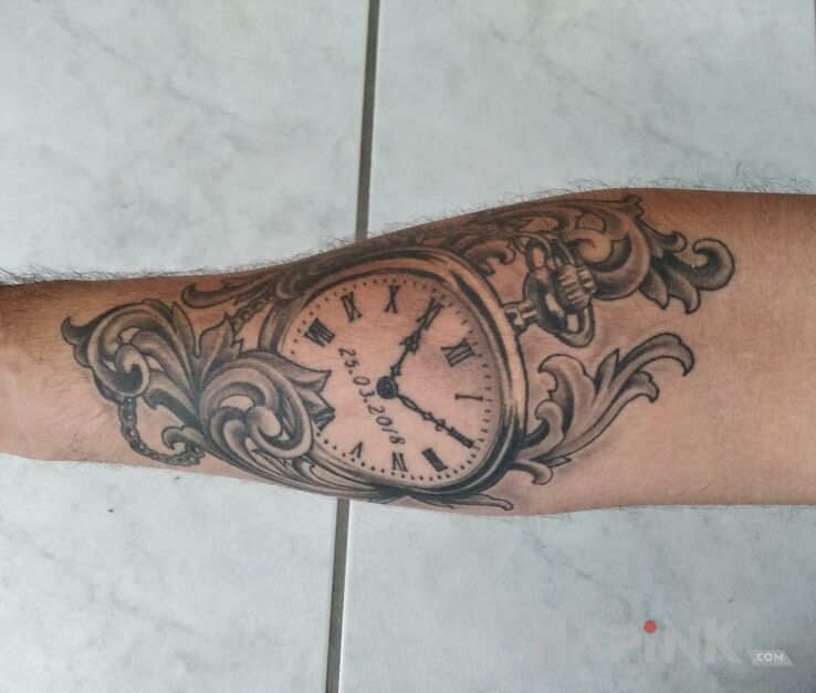Tattoo Pocket watch in objects motif and realistic style on the forearm