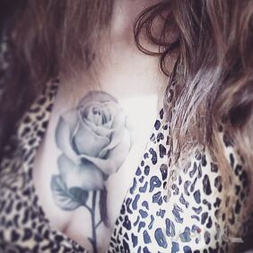 Tattoo Rose on the breast motif: flowers style: realistic