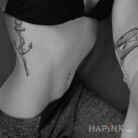 Tattoo Anchor on the ribs motif: black and gray style: graphic / illustrative