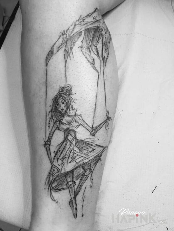 Tattoo Doll in black and gray motif and sketch style on the calf