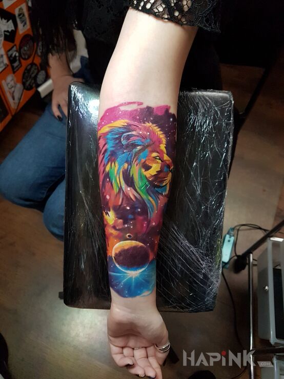 Tattoo SPACE LION in cosmos motif and graphic / illustrative style on the forearm