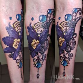 Tattoo Mandalo flowers on the forearm motif: ornaments style: realistic