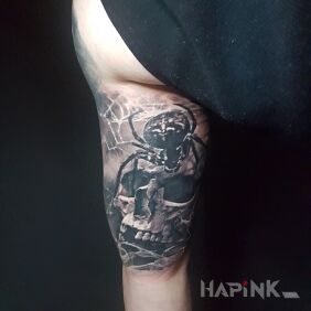 Tattoo Skull + spider on the upper arm motif: skulls style: realistic