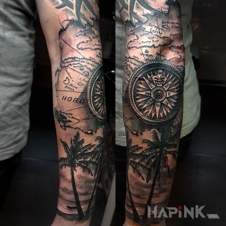 Tattoo COMPAS in black and gray motif and realistic style on the forearm