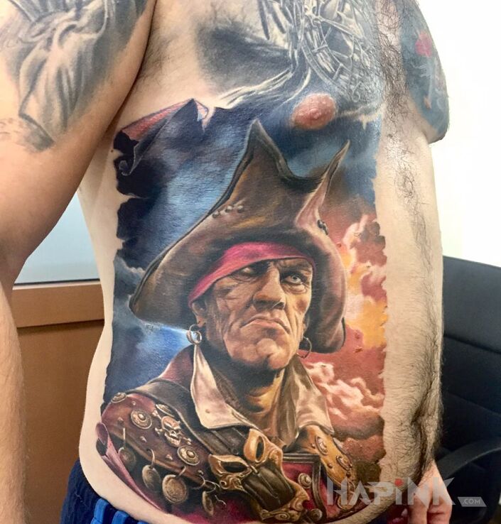 Tattoo PIRAT in characters motif and realistic style on the stomach