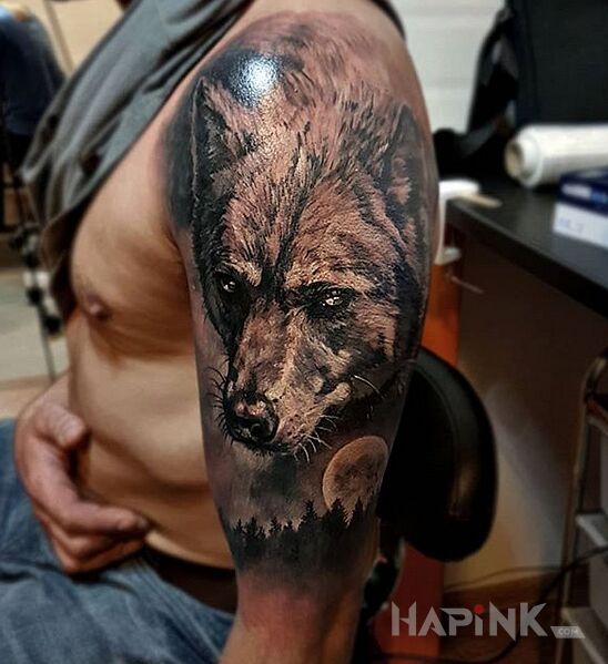 Tattoo Wilk in black and gray motif and realistic style on the upper arm
