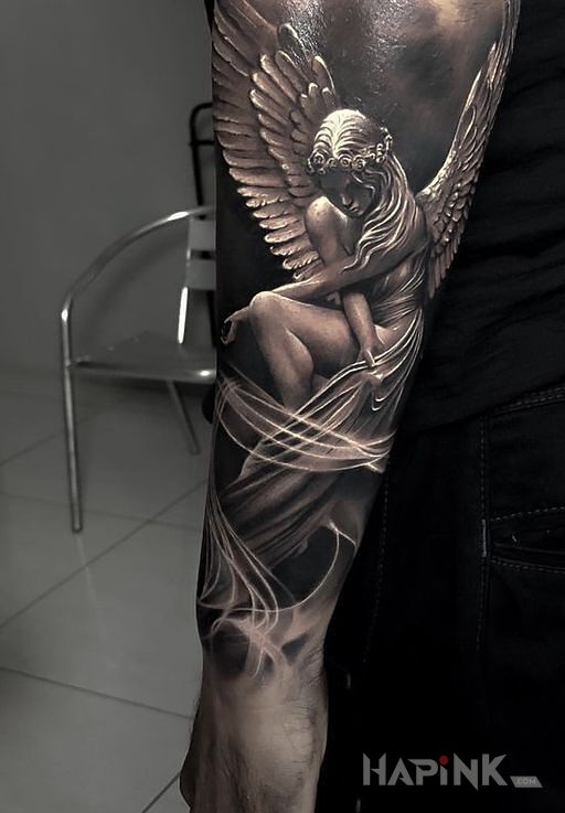 Tattoo Nagi aniołek in angels motif and realistic style on the forearm