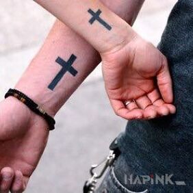 Tattoo Two crosses on the forearm motif: religious
