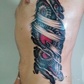 Tattoo Biomechanics on the ribs motif: anatomical style: biomechanics