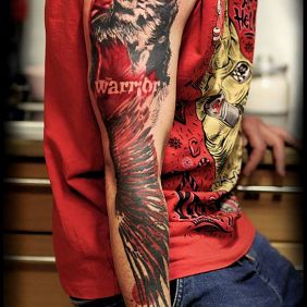 Tattoo Warrior on the upper arm motif: animals style: trash polka