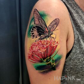 Tattoo Butterfly and flower on the upper arm motif: butterflies style: realistic