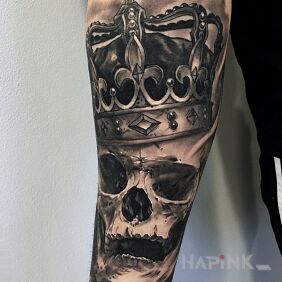 Tattoo The crowned chela on the forearm motif: skulls style: realistic