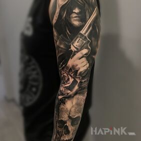 Tattoo Revolver sleeve on the forearm motif: black and gray style: realistic