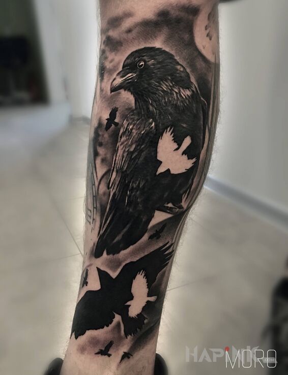 Tattoo Kruki od Igoryoshi in black and gray motif and realistic style on the calf