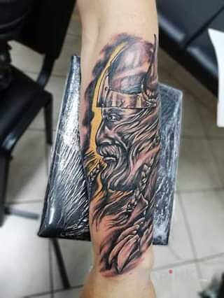Tattoo Wiking weteran in faces motif and graphic / illustrative style on the forearm