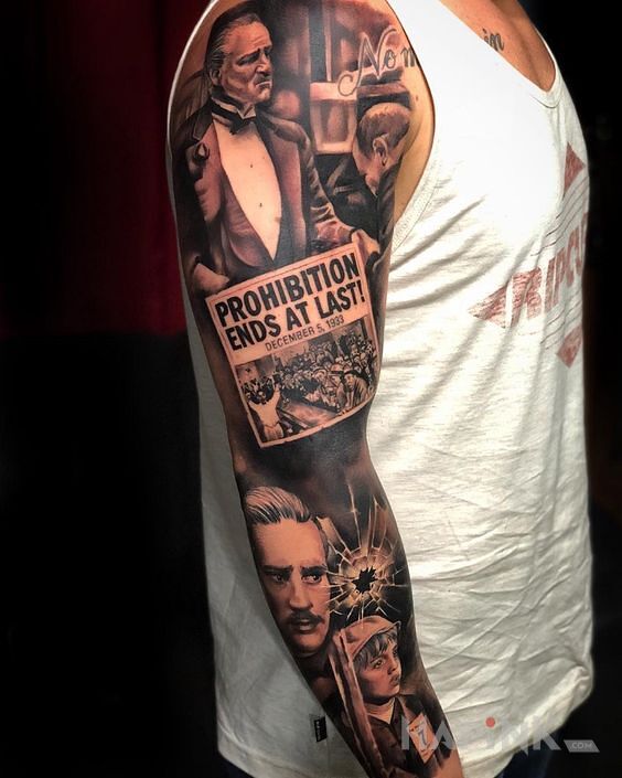 Tattoo La mafia in black and gray motif and realistic style on the upper arm