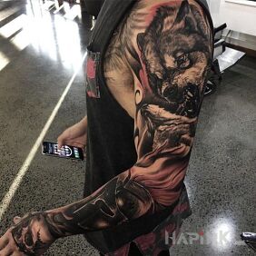 Tattoo Wolf on the attack on the forearm motif: characters style: realistic