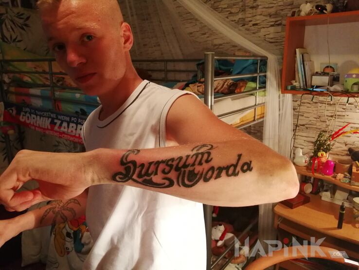 Tattoo Drugi skończony in lettering motif and calligraphy style on the forearm